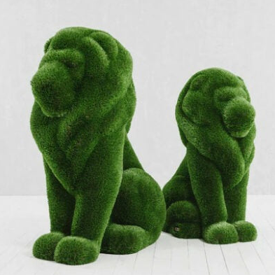 sentado león topiario